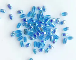 Korálek mačkaný ZRNKO 9/5mm crystal AB modrá