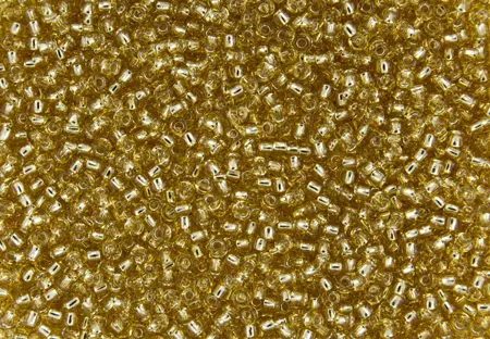 Rokajlové korálky Toho  - Round 15/0 : Silver-Lined Lt Topaz TR-15-22